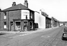 John Street from the junction with Countess Road No. 133 Arthur Crookes, off licence; garages; Nos. 143 - 151; the junction of Baron Street; Nos. 155 - 181 looking towards Shoreham Street