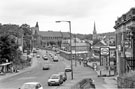 Barnsley Road with the junction of Skinnerthorpe Road right looking towards St. Cuthberts Church (left) and the spire of Trinity Methodist Church, Fir Vale 