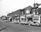 Nos. 70, S. and L. Exchange; 72a, Lindsay, J, hairdresser; W. Evans, greengrocer; 76;78, etc., Spital Hill looking towards Ellesmere Road
