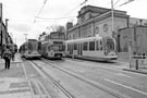Supertrams No. 4 and 9 at Hillsborough Supertram Stop, Langsett Road with former Hillsborough Baths right