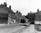 View: s25838 Nos. 17- 21; 23-33 and 35-39 left and Attercliffe Police Station (right), Whitworth Lane looking towards Brown Bayleys Ltd. showing the junctions with Holbeck Street and Baildon Street