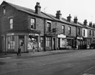 Nos. 240, Roger, gents hairdresser; 238; 236, Fred Jubb, butcher; 234; etc., Petre Street from the junction with Carwood Road 