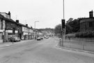 Firth Park Road from the junction with Owler Lane looking towards the junctions with Barnsley Road and Herries Road with St. Cuthberts Church right
