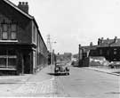  Nos. 69, corner shop; 71; 73 etc., Shirland Lane looking towards Shirland Lane Bridge with the rear of housing on Chippingham Street right