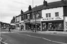 Nos. 699, March the Tailor; 697, Photography Shop; 695, Clobber Boutique;  693; 691, Victor Unwin, butcher and 689, Blaskeys, Staniforth Road looking towards the junction with Irving Street (right) from Main Road