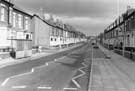 Staniforth Road from Ribston Road (left) showing refurbished properties and parking bays, No. 479, G. Cliff and Son Ltd., timber supplies (clock outside right)