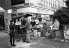 View: s27481 Newspaper and chestnut sellers outside Richard Shops Ltd., Fargate at junction with Chapel Walk