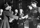 Lt. Col. D.B. Webster, Hallamshire Battalion, Yorks and Lancaster Regiment T.A. being presented to Queen Elizabeth II outside the Town Hall by Lord Mayor, J.H. Bingham with John Heys, town clerk; Mrs. Heys and Chief Constable G