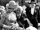 Queen Elizabeth II being presented with a bouquet by 11 year old Jane Richardson granddaughter of Lord Mayor, Albert Richardson