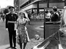 Queen Elizabeth II after a walk about in Fargate accompanied by Lord Lieutenant of South Yorkshire, Gerard Young with HRH Duke of Edinburgh in the background