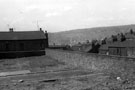 Rear of Nos. 16, 18 and 20, Fowler Terrace (left) and housing on Birley Street from derelict Fowler Place looking towards Netherthorpe