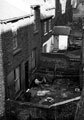 No. 1, Court 2, Grove Street, showing adjoining high walls and steps down to passage under house leading to the street. This area was dark, a fire hazard and had lack of air circulation, demolished May, 1960