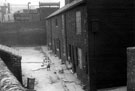 View: t00515 The Bryan Family children who lived at No. 5 showing Nos. 6 - 1, Canal Cottages, Tinsley Park Road, (demolished February 1958), looking towards Electric Sub Station and Chemical Works