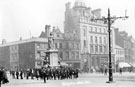 Town Hall Square and Fargate, looking towards Leopold Street, including No 70 Charles A. George, chemist (corner of Leopold Street), No. 68 Loxley Brothers Ltd., printers, No. 66 Fleur de Lis P. H. and Bank Chambers, Queen Victoria Statue, foreground