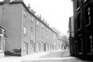 Nos. 165 - 183 (left) and Nos. 148, 150 etc., Woodside Lane looking towards the junction with Wood Fold. Demolished January 1960