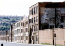 Derelict Firth Vickers, Staybrite Works, (formerly Thomas Firth and Sons), Weedon Street with housing on Wincobank Hill in the background