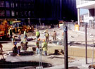 Filling in the 'Hole in the Road', Castle Square, during the construction of Supertram, looking towards Angel Street Filling in the 'Hole in the Road', Castle Square, during the construction of Supertram, looking towards Angel Street