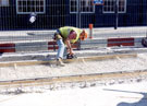 Workmen on West Street during the construction of Supertram