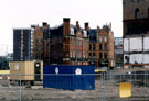 Archaeological dig at Exchange Riverside, Nursery Street, where remains of early cementation furnace were excavated. Royal Exchange Buildings in background
