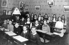 Pupils and Sister in a classroom at the Convent High School, No. 152 Burngreave Road Pupils and Sister in a classroom at the Convent High School, No. 152 Burngreave Road