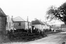 Broad Elms Lane near the junction with Bents Road. The stone built building on the left is 55 Bents Road