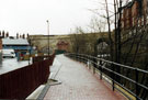 View: t02616 Completed section of the Five Weirs Walk footpath lookig towards the Victoria Station Viaduct with the Royal Victoria Holiday Inn right