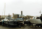 Motor cruisers during restoration of the Canal Basin, Sheffield and South Yorkshire Navigation with Hyde Park Flats in the background