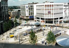 Elevated view of Castle Square Supertram stop showing C and A Modes Ltd., Nos. 59 - 65 High Street and Castle House B and C Co-op, corner of Angel Street and King Street