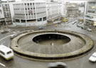Elevated view of The Hole in the Road, Castle Square roundabout looking towards C and A Modes Ltd., Nos. 59 - 65 High Street