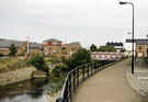 River Don, Hecla Section of the Five Weirs Walk showing Newhall Bridge, Newhall Road and Riverside Court (left) and Gun Shop, River Don Works in the background River Don, Hecla Section of the Five Weirs Walk showing Newhall Bridge, Newhall Road and Riverside Court (left) and Gun Shop, River Don Works in the background