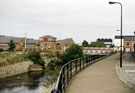 River Don, Hecla Section of the Five Weirs Walk showing Newhall Bridge, Newhall Road and Riverside Court (left) and Gun Shop, River Don Works in the background