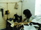 View: t03103 Sewing machinist at work S. D. Williams, tailors, Butcher Works, No. 72 Arundel Street