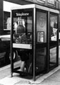 Telephone kiosk in use, Cambridge Street