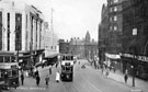 View: t03147 High Street looking toward Commercial Street with policeman on point duty; Change Alley between No.76-8 G.A. Dunn and Co., hatters and No. 80-84 Alexandre Ltd.(Tip Top Tailors); Montague Burtons Ltd. tailors and CandA Modes (left) and