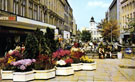 View: t03156 Floral display, Fargate with W.H. Smith's left looking towards Telegraph and Star Building (Kemsley House)