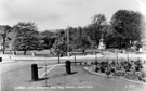 Hunters Bar showing the old toll bar posts with the entrance to Endcliffe Park and the Queen Victoria Monument in the background 