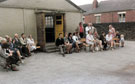 Queen Elizabeth II Silver Jubilee celebrations organised by Mrs Hilda Morris with many of the residents of Argyle Close outside the canteen entrance to Carfield School School with Argyle Road in the background