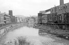 View of the River Don from the Iron Bridge looking towards John Aizelwood Ltd., Crown Flour Mills and Holy Trinity Church, Nursery Street left and rear of Steel Works, Bridge Street View of the River Don from the Iron Bridge looking towards John Aizelwood Ltd., Crown Flour Mills and Holy Trinity Church, Nursery Street left and rear of Steel Works, Bridge Street