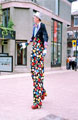 Stiltwalker outside the Ruskin Gallery, Tudor Square during the World Student Games Cultural Festival Opening Procession Stiltwalker outside the Ruskin Gallery, Tudor Square during the World Student Games Cultural Festival Opening Procession