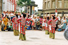 View: t04686 Tibetan Dance Team, Fargate with Barkers Pool in the background during the World Student Games Cultural Festival 