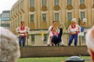 Russian Deaf Theatre Group, Tudor Square during the World Student Games Cultural Festival with the Town Hall extension (known as the Egg Box (Eggbox)) in the background