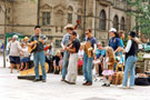 View: t04711 Old Joe Zydygo Cajun Street Band, Fargate during the World Student Games Cultural Festival with the Town Hall in the background
