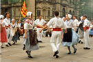 View: t04781 Lei Courcoussoun Dance Group from France performing in Fargate during the Cultural Festival with the Town Hall in the background