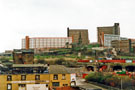 Demolition of one block of Hyde Park Flats showing St. Johns Church looking across the Canal Basin