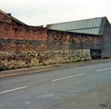Grinding wheels in the wall on the site of the former Attercliffe Steelworks, Stevenson Road