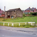 Main Road, Wharncliffe Side at the junction of Brightholmlee Lane with housing on Don Avenue in the background
