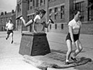 Physical training during Education Week at Burngreave County School (later Byron Wood Infant and Junior School) with with housing on Sun Street in the background