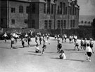 Physical training during Education Week at Morley Street School with the back of the houses on Morley Street in the background