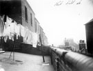 Yard of No. 50 Park Hill Lane, in foreground and roofs of housing in Staniforth Lane