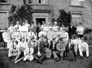 Members of a cricket team and friends, J.G. Graves seated 5th from right, wife Lucy on his right